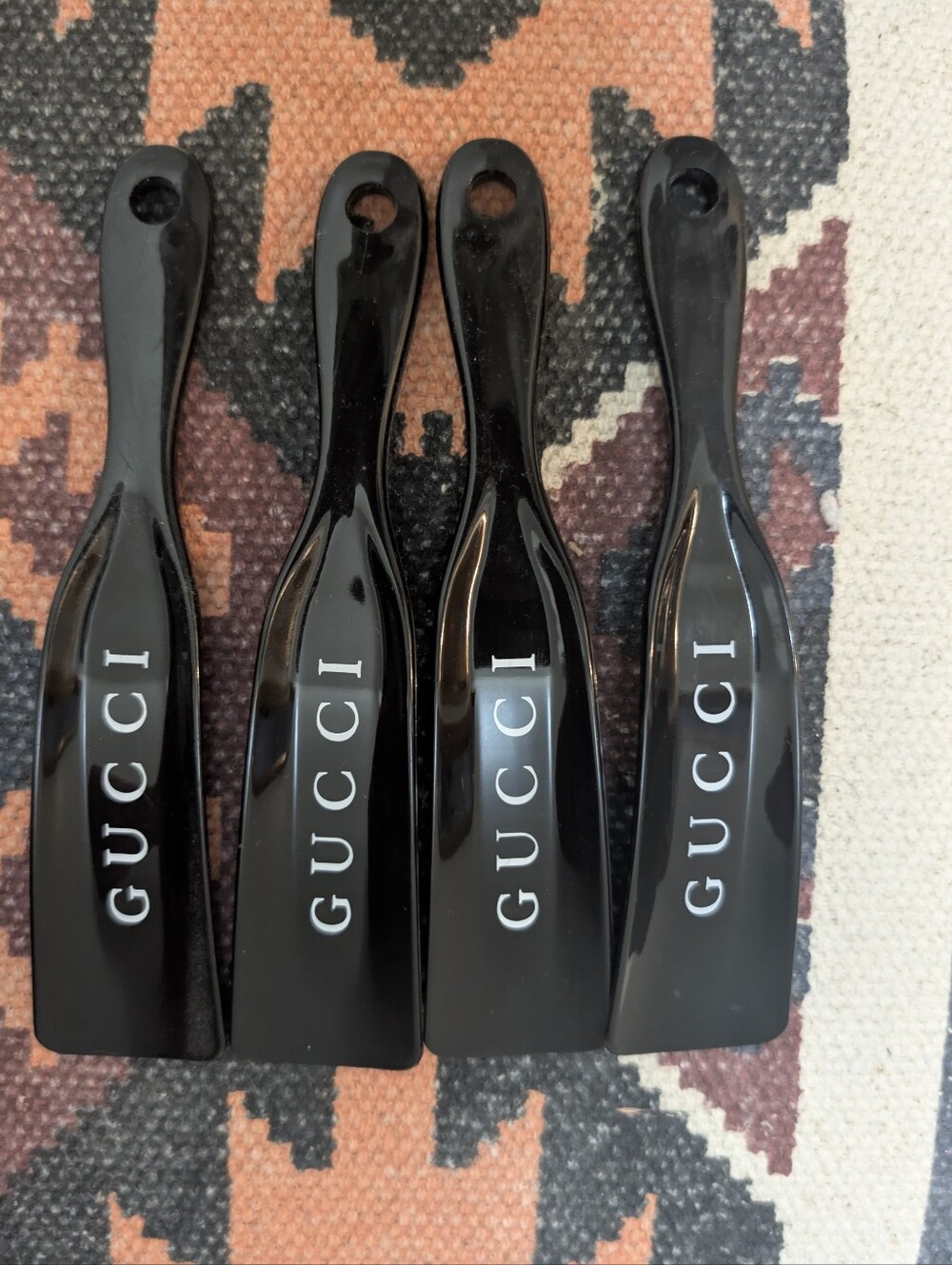 Gucci Glossy Black Plastic Shoe Horns with White Logo - Set of 4